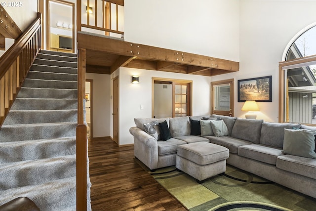 17692 Rogue Ln, Sunriver, OR 97707 - living room with dark wood-style flooring, a high ceiling, and stairs