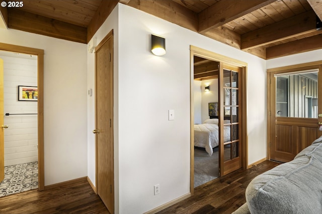 17692 Rogue Ln, Sunriver, OR 97707 - bedroom with wooden ceiling with exposed beams, wood finished floors, baseboards, and a closet