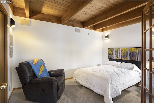 17692 Rogue Ln, Sunriver, OR 97707 - bedroom with wooden ceiling with exposed beams, carpet, and baseboards