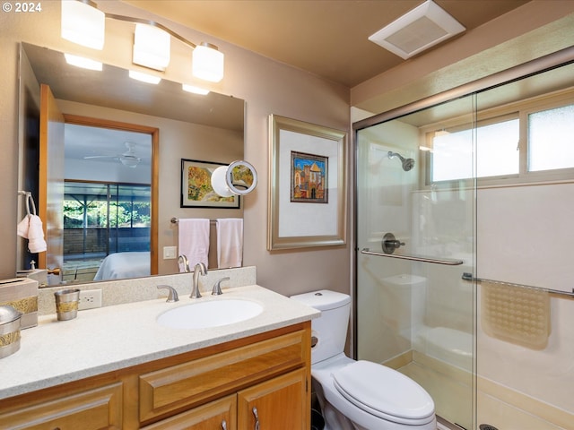 full bathroom with visible vents, vanity, toilet, connected bathroom, and a shower stall