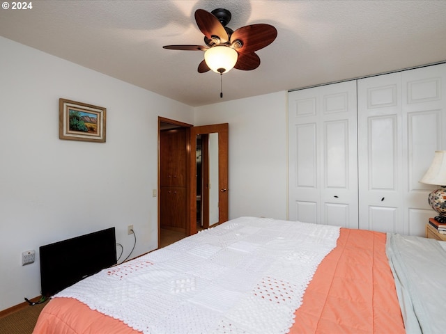 bedroom with a closet, carpet, and ceiling fan