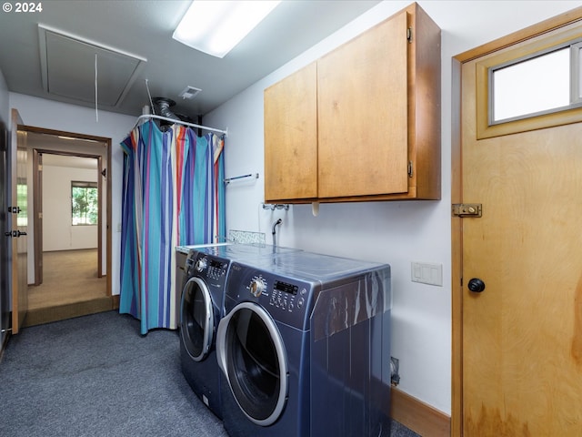 laundry room with cabinet space, separate washer and dryer, carpet flooring, and attic access
