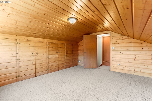 additional living space featuring vaulted ceiling, wooden ceiling, carpet flooring, and wood walls