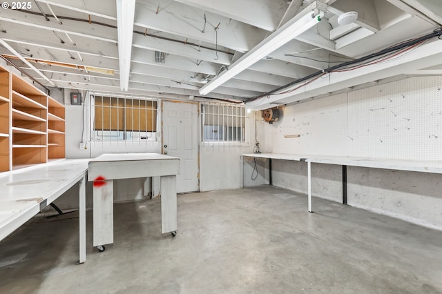 unfinished below grade area featuring a workshop area