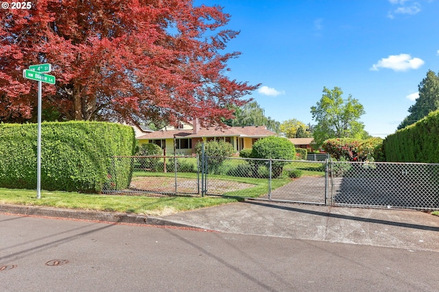 view of front of property with a gate and fence