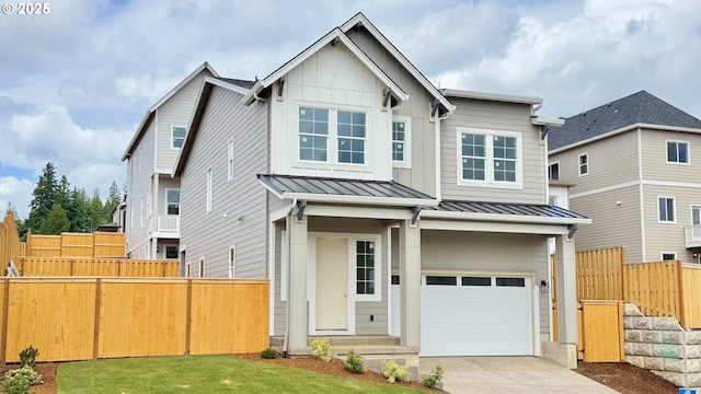 17955 SW Howlock Ln, Beaverton, OR 97007 - view of front of property featuring an attached garage, a standing seam roof, fence, concrete driveway, and board and batten siding