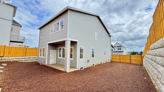 17955 SW Howlock Ln, Beaverton, OR 97007 - rear view of house with a fenced backyard