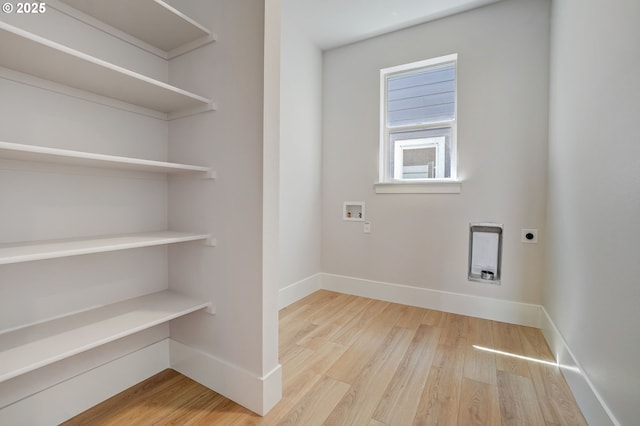17955 SW Howlock Ln, Beaverton, OR 97007 - laundry area with electric dryer hookup, wood finished floors, baseboards, and hookup for a washing machine