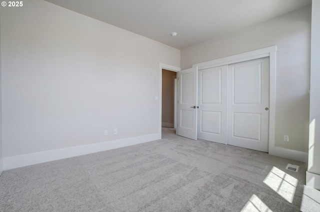 17955 SW Howlock Ln, Beaverton, OR 97007 - unfurnished bedroom with carpet floors, a closet, and baseboards