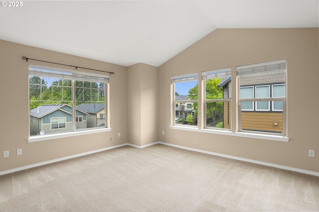 1544 SW 175th Ave, Beaverton, OR 97003 - unfurnished room featuring plenty of natural light, carpet, lofted ceiling, and baseboards