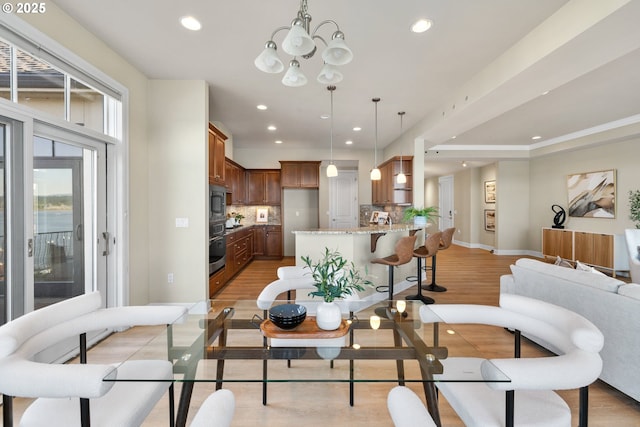 707 N Hayden Island Dr Unit 415, Portland, OR 97217 - dining space with a chandelier, light wood-type flooring, and recessed lighting