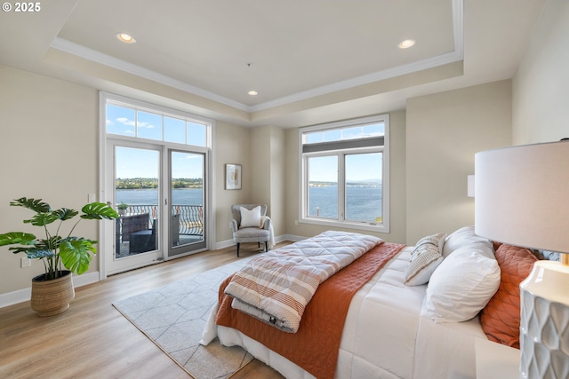 707 N Hayden Island Dr Unit 415, Portland, OR 97217 - bedroom with a tray ceiling, multiple windows, access to outside, recessed lighting, and crown molding