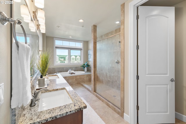 707 N Hayden Island Dr Unit 415, Portland, OR 97217 - bathroom with double vanity, a garden tub, a stall shower, a chandelier, and tile patterned flooring