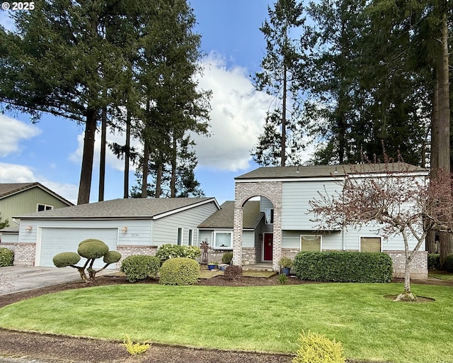 3270 N Maple St, Canby, OR 97013 - view of front of property featuring a front lawn, concrete driveway, brick siding, and an attached garage