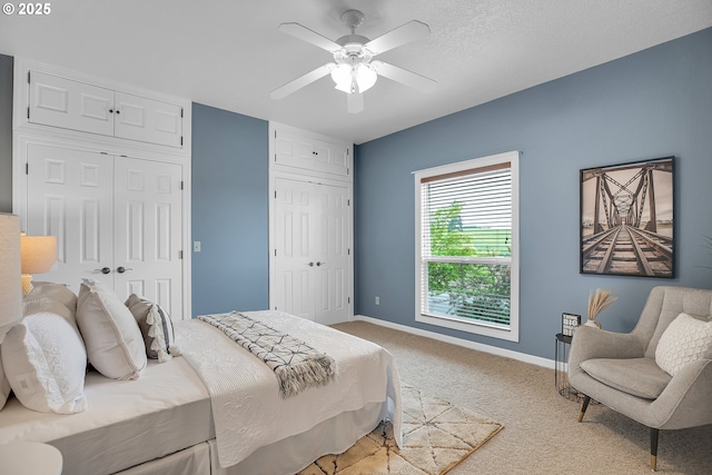 3270 N Maple St, Canby, OR 97013 - bedroom featuring light colored carpet, ceiling fan, baseboards, and multiple closets