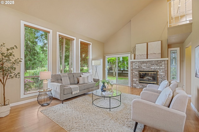 3270 N Maple St, Canby, OR 97013 - living room featuring high vaulted ceiling, wood finished floors, baseboards, and healthy amount of natural light
