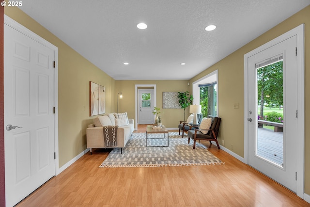 3270 N Maple St, Canby, OR 97013 - living room with light wood-type flooring, baseboards, recessed lighting, and a textured ceiling