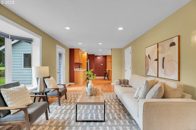 3270 N Maple St, Canby, OR 97013 - living room with light wood-type flooring, recessed lighting, and baseboards