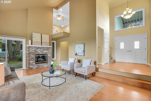 3270 N Maple St, Canby, OR 97013 - living area with a towering ceiling, wood finished floors, baseboards, plenty of natural light, and a ceiling fan