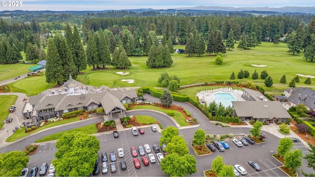 3270 N Maple St, Canby, OR 97013 - drone / aerial view of a forest, mountains, a golf course, and a pool area