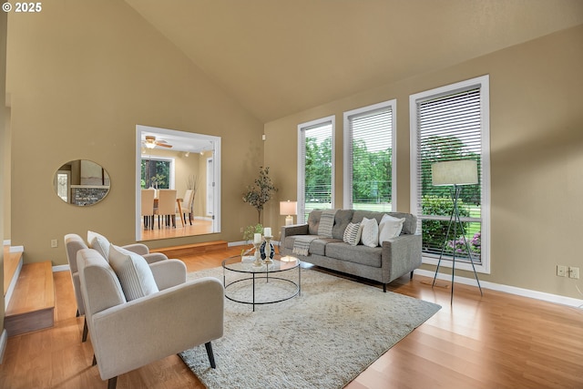 3270 N Maple St, Canby, OR 97013 - living room with healthy amount of natural light, high vaulted ceiling, baseboards, wood finished floors, and ceiling fan