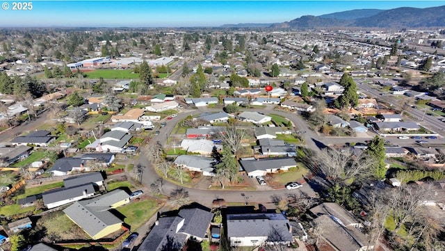 birds eye view of property with a mountain view