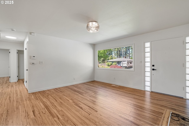 116 SE 153rd Ave, Portland, OR 97233 - foyer entrance featuring light wood-style flooring and baseboards