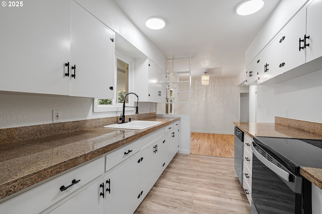 116 SE 153rd Ave, Portland, OR 97233 - kitchen with a sink, white cabinets, light wood-style floors, and appliances with stainless steel finishes