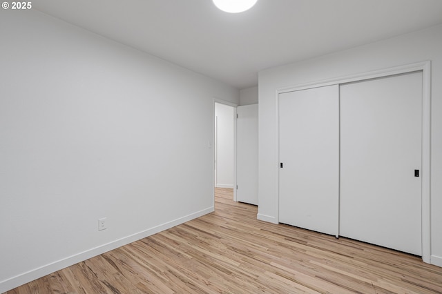 116 SE 153rd Ave, Portland, OR 97233 - unfurnished bedroom featuring light wood finished floors, baseboards, and a closet