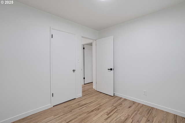 116 SE 153rd Ave, Portland, OR 97233 - unfurnished bedroom with light wood-style flooring and baseboards