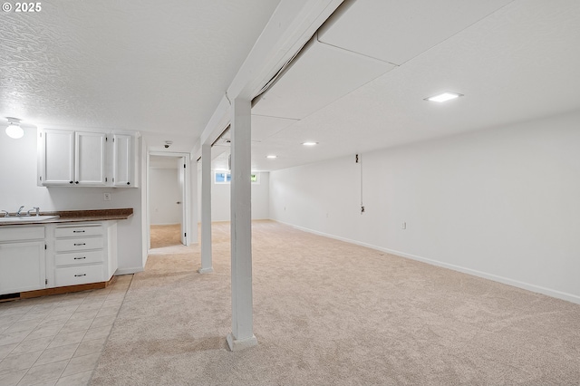116 SE 153rd Ave, Portland, OR 97233 - basement featuring light colored carpet, baseboards, and recessed lighting