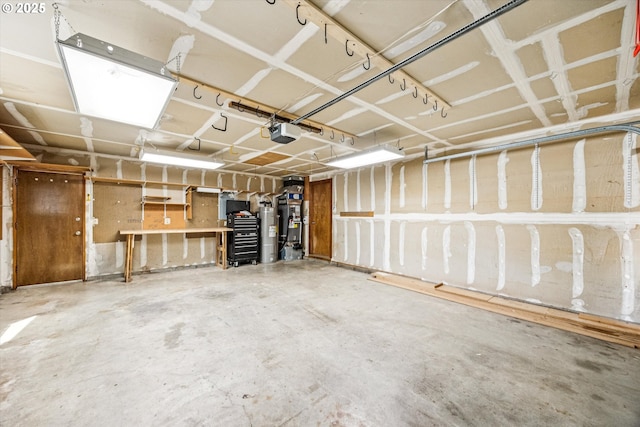 51945 SW Creekview Pl, Scappoose, OR 97056 - garage featuring a garage door opener and water heater
