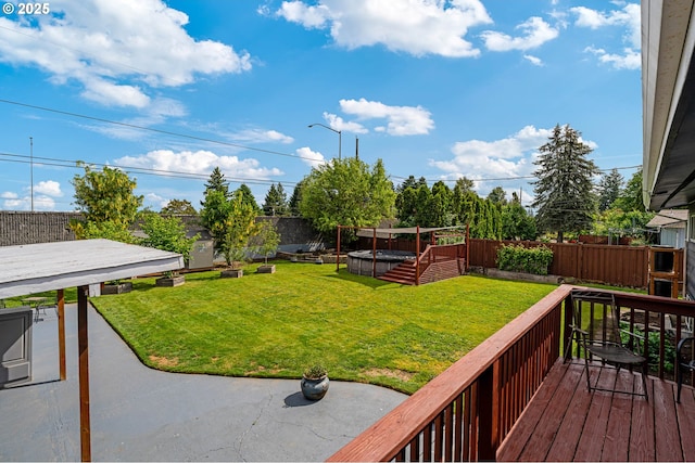 view of yard featuring a deck and a patio area