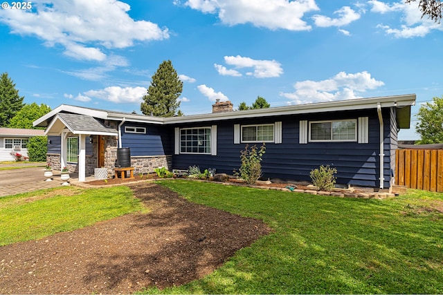 ranch-style house with a chimney and stone siding