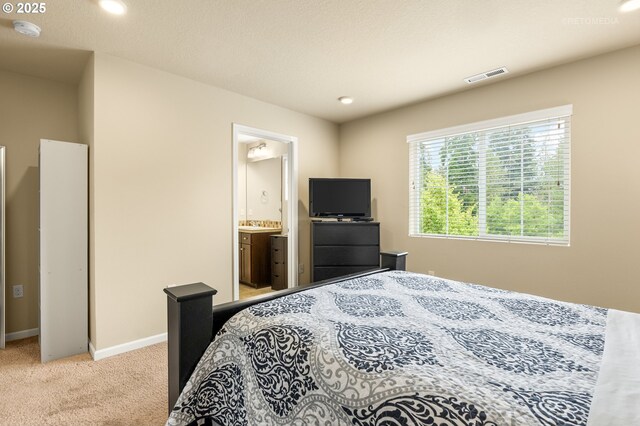 21889 SW Cedar Brook Way, Sherwood, OR 97140 - bedroom with carpet, connected bathroom, and recessed lighting