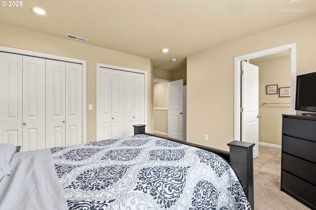 21889 SW Cedar Brook Way, Sherwood, OR 97140 - bedroom with two closets, recessed lighting, and light colored carpet