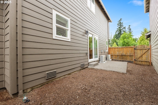 21889 SW Cedar Brook Way, Sherwood, OR 97140 - view of side of property featuring a gate and a patio