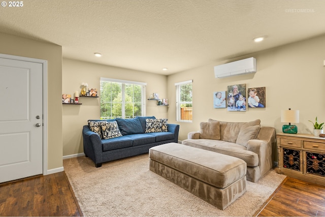21889 SW Cedar Brook Way, Sherwood, OR 97140 - living area featuring a wall mounted AC, wood finished floors, recessed lighting, and a textured ceiling