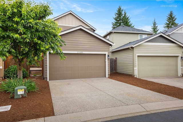 21889 SW Cedar Brook Way, Sherwood, OR 97140 - view of front of home featuring concrete driveway, a garage, and an outdoor structure