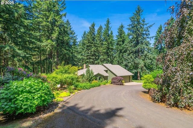 16649 S Holcomb Blvd, Oregon City, OR 97045 - view of front of property with a garage and a view of trees