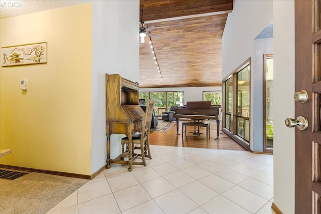 16649 S Holcomb Blvd, Oregon City, OR 97045 - foyer entrance with high vaulted ceiling, light tile patterned flooring, ceiling fan, baseboards, and wooden ceiling