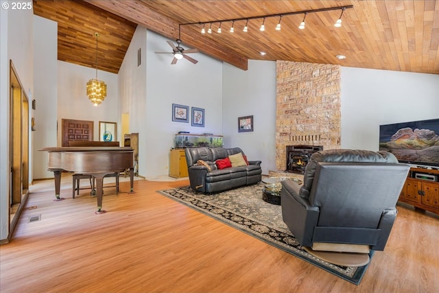 16649 S Holcomb Blvd, Oregon City, OR 97045 - living room with wooden ceiling, light wood-style flooring, high vaulted ceiling, ceiling fan, and rail lighting