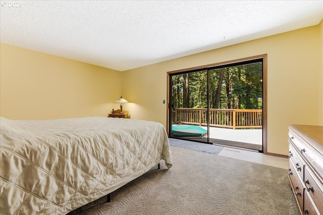 16649 S Holcomb Blvd, Oregon City, OR 97045 - bedroom with access to exterior, a textured ceiling, and baseboards