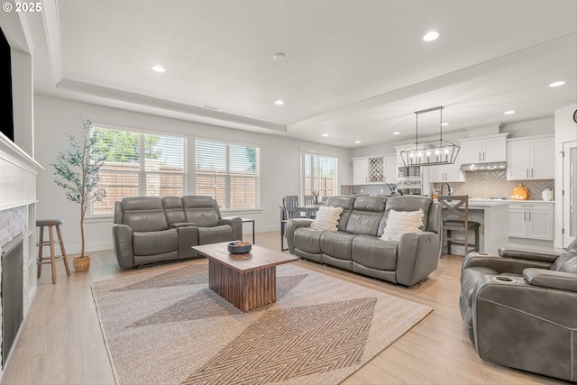 7705 NE 181st Ct, Vancouver, WA 98682 - living room featuring healthy amount of natural light, baseboards, a fireplace, and recessed lighting