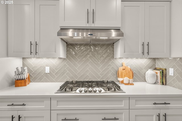 7705 NE 181st Ct, Vancouver, WA 98682 - kitchen featuring stainless steel gas stovetop, exhaust hood, light countertops, and backsplash