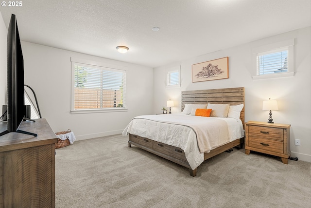7705 NE 181st Ct, Vancouver, WA 98682 - bedroom with multiple windows, baseboards, and light colored carpet
