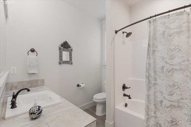 full bath with shower / tub combo with curtain, wood finished floors, a sink, and toilet