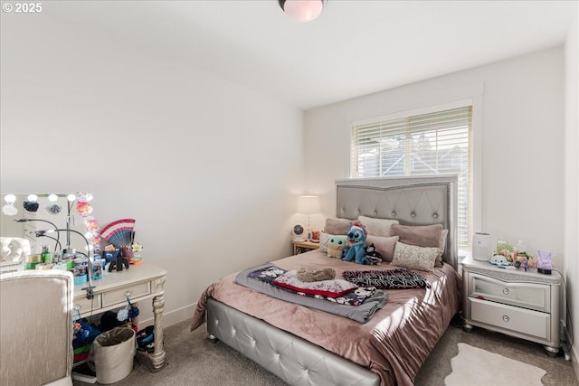 carpeted bedroom featuring baseboards