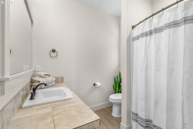 7705 NE 181st Ct, Vancouver, WA 98682 - bathroom featuring toilet, vanity, wood finished floors, baseboards, and a shower with curtain
