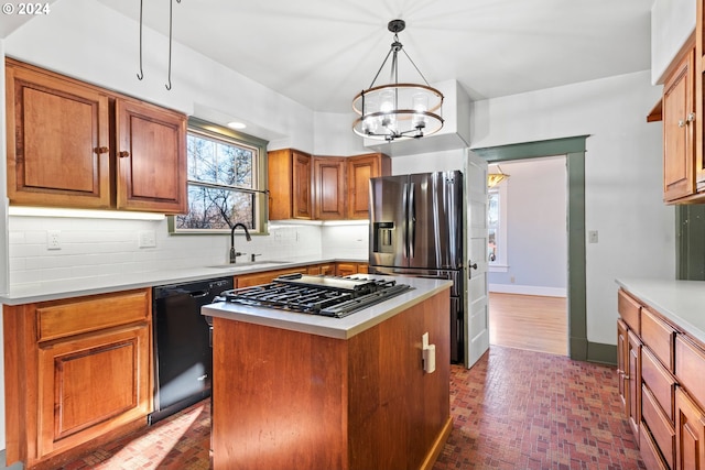 1706 Oak St, La Grande, OR 97850 - kitchen with stainless steel fridge, a sink, black dishwasher, gas stovetop, and backsplash